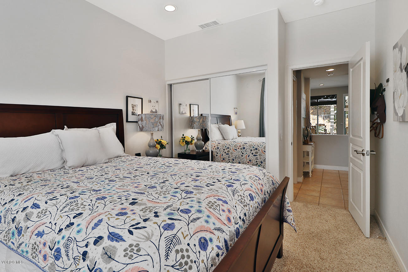 143 Brooks Road Simi Valley, CA 93065 - Photo 18 of 42 a bedroom with a large bed and wooden floor