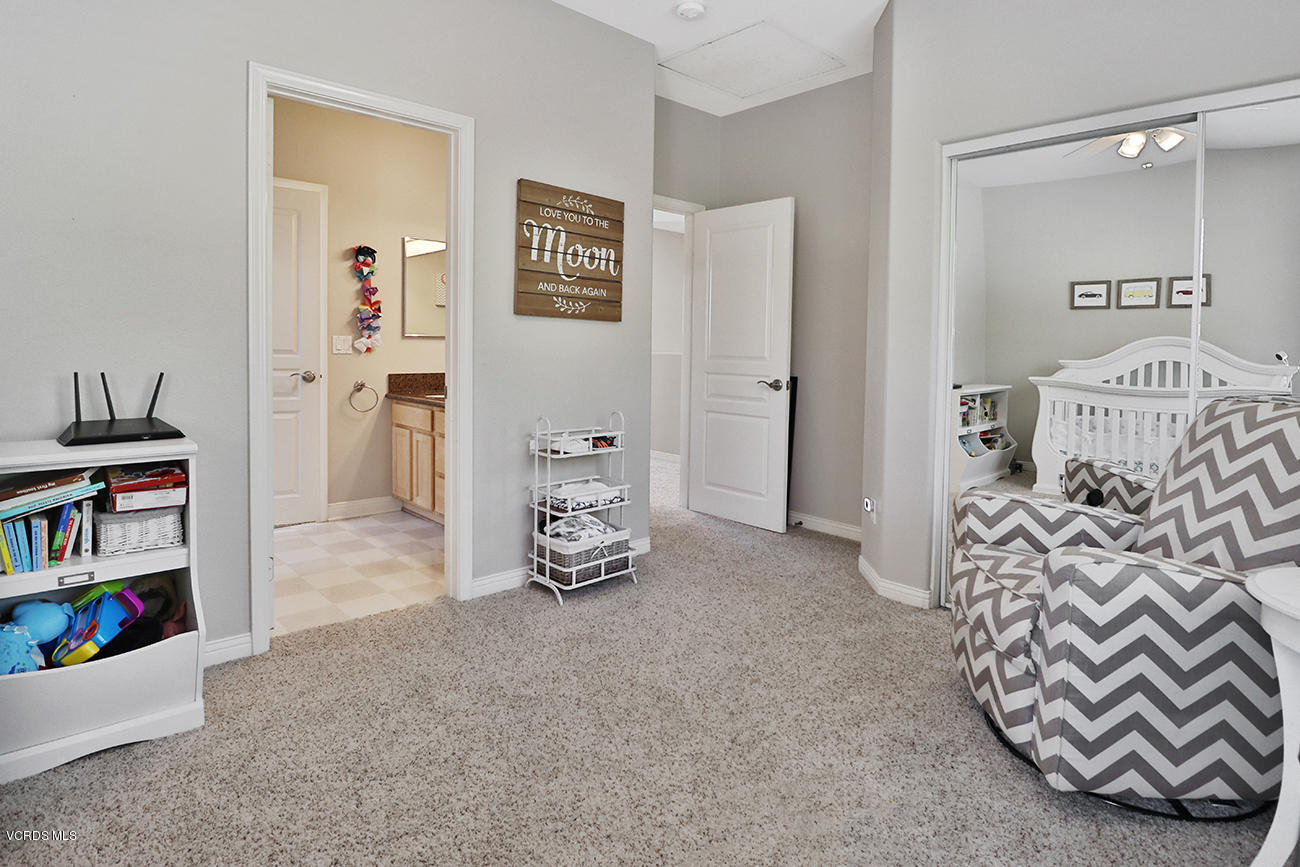 143 Brooks Road Simi Valley, CA 93065 - Photo 25 of 42 a view of a livingroom with shelves