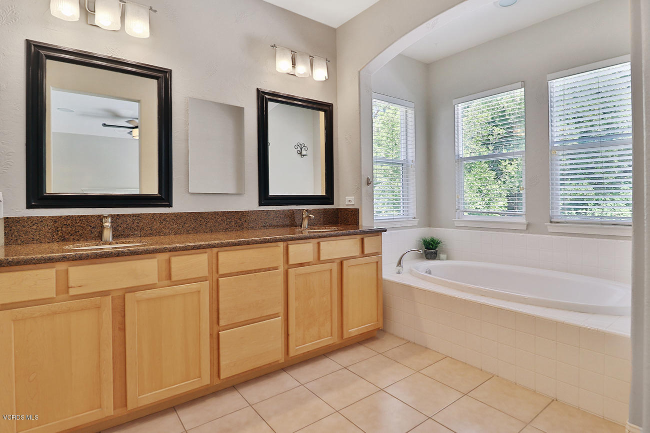 143 Brooks Road Simi Valley, CA 93065 - Photo 28 of 42 a bathroom with a bathtub a sink and a window