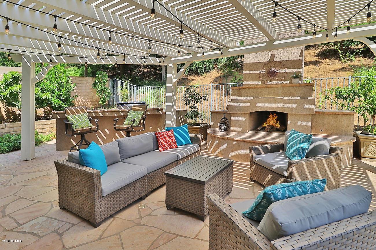 143 Brooks Road Simi Valley, CA 93065 - Photo 36 of 42 a view of a patio with couches and a fireplace