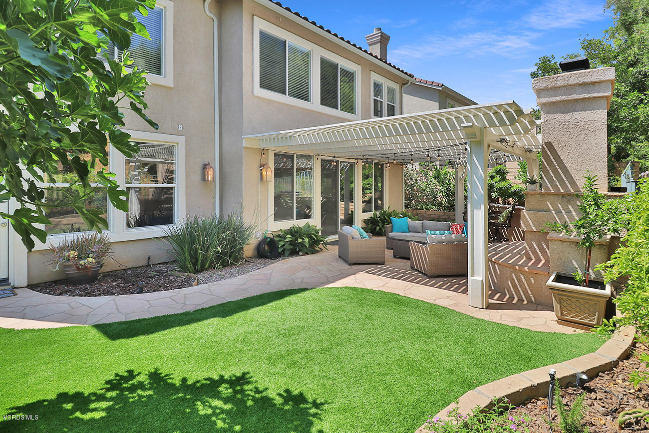 143 Brooks Road Simi Valley, CA 93065 - Photo 38 of 42 a view of a house with a yard and furniture