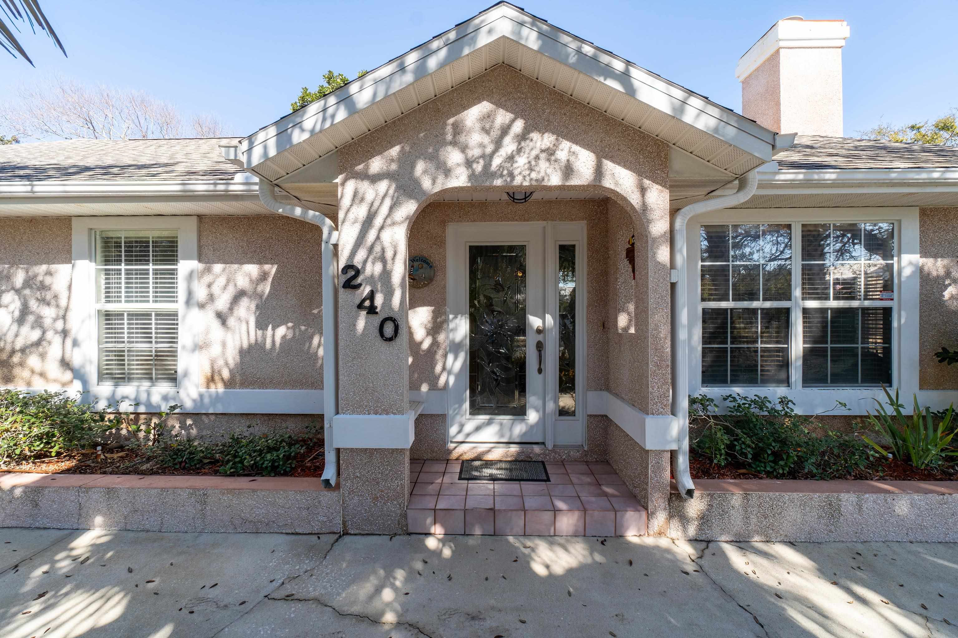 240 Micklers Road St. Augustine, FL 32080 - Photo 25 of 74 a view of a building with potted plants
