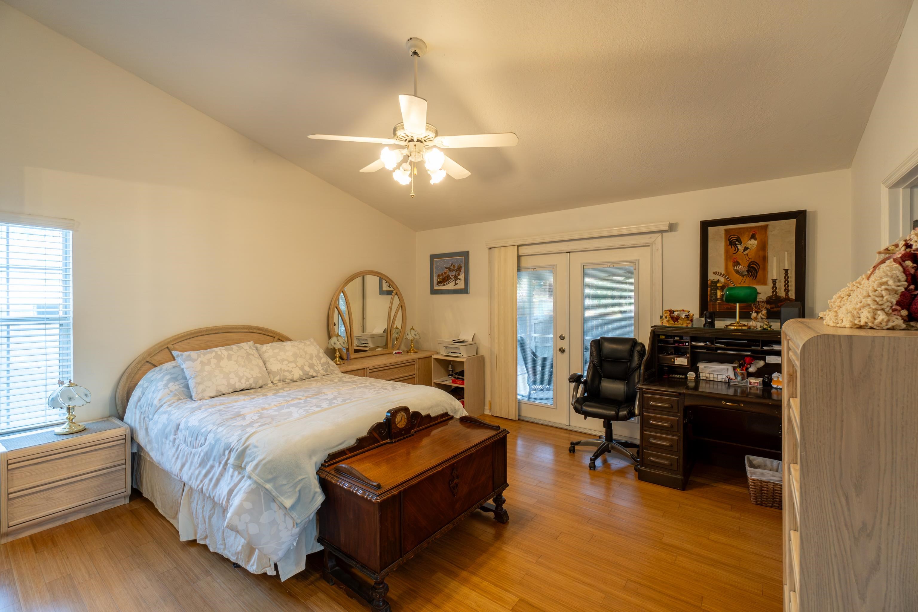 240 Micklers Road St. Augustine, FL 32080 - Photo 38 of 74 a bedroom with a bed couch and a window