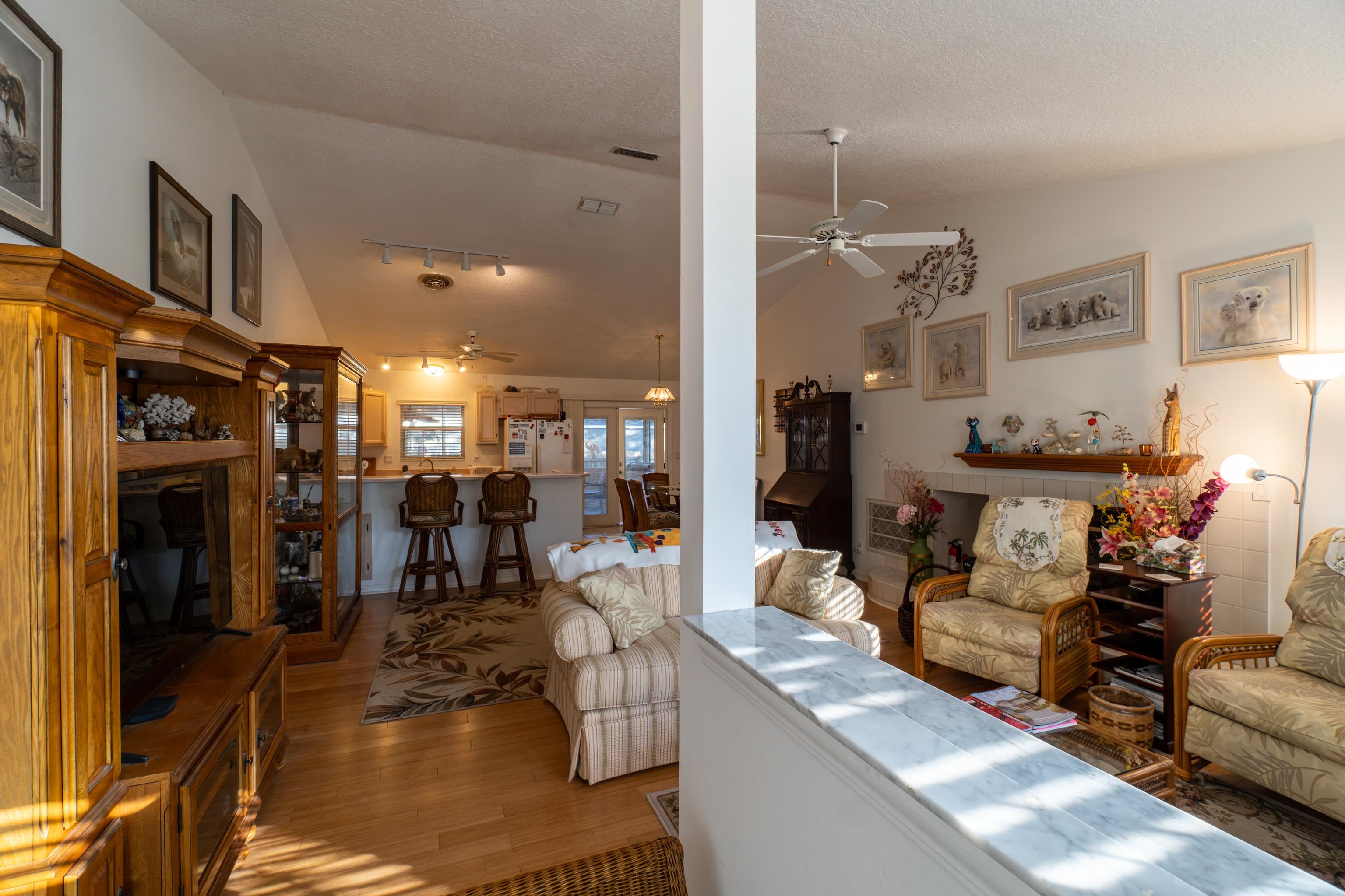 240 Micklers Road St. Augustine, FL 32080 - Photo 47 of 74 a living room with fireplace furniture and a flat screen tv