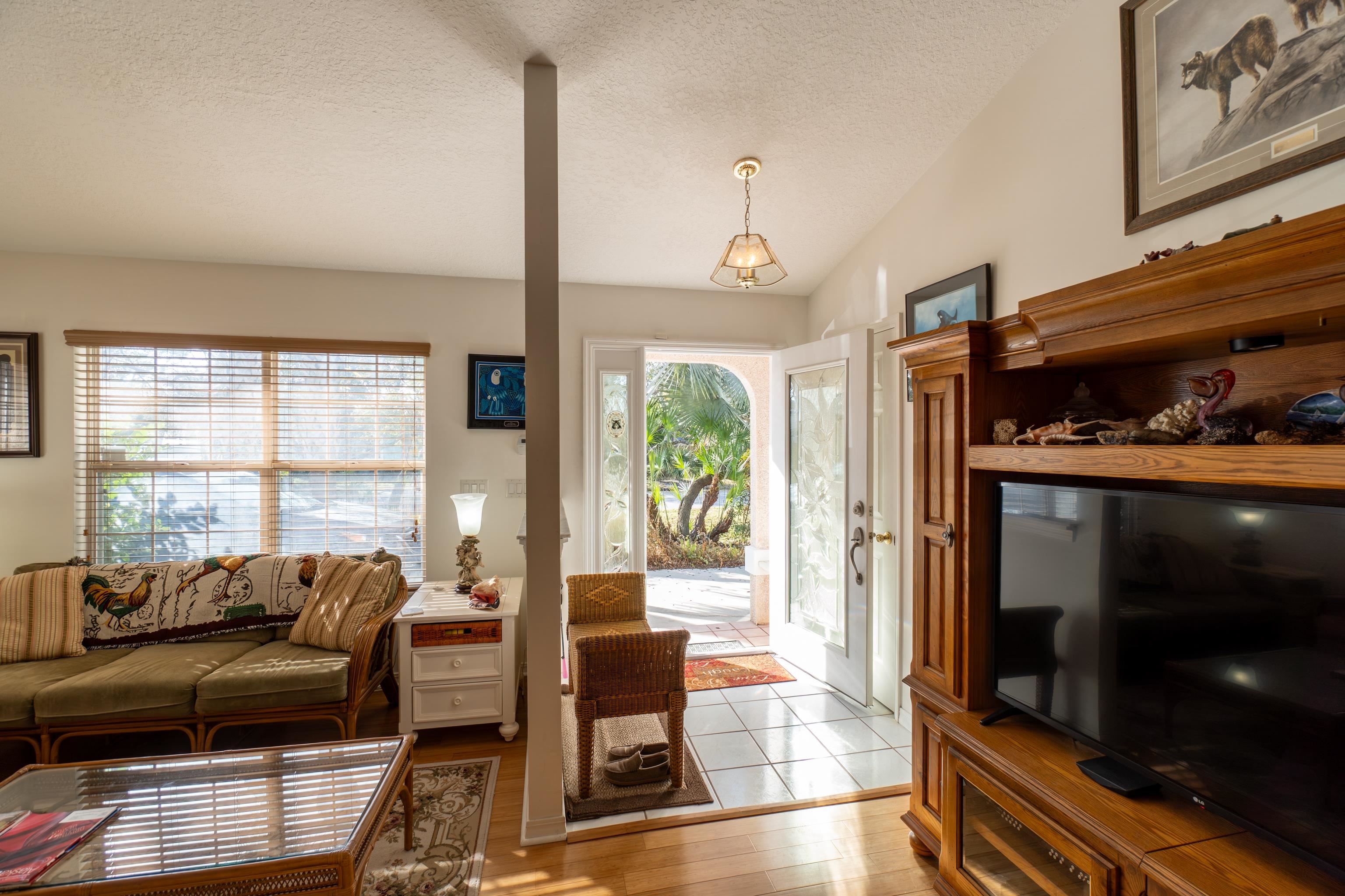 240 Micklers Road St. Augustine, FL 32080 - Photo 66 of 74 a living room with furniture and a flat screen tv