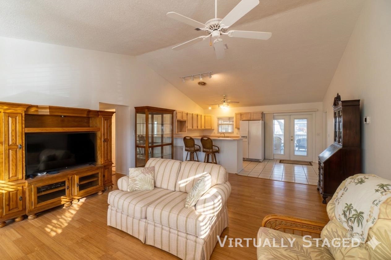 240 Micklers Road St. Augustine, FL 32080 - Photo 71 of 74 a living room with furniture and a flat screen tv