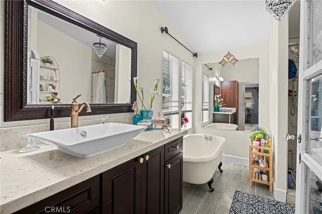 a bathroom with a sink double vanity and a mirror