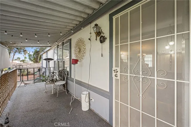 a view of a porch with seating space