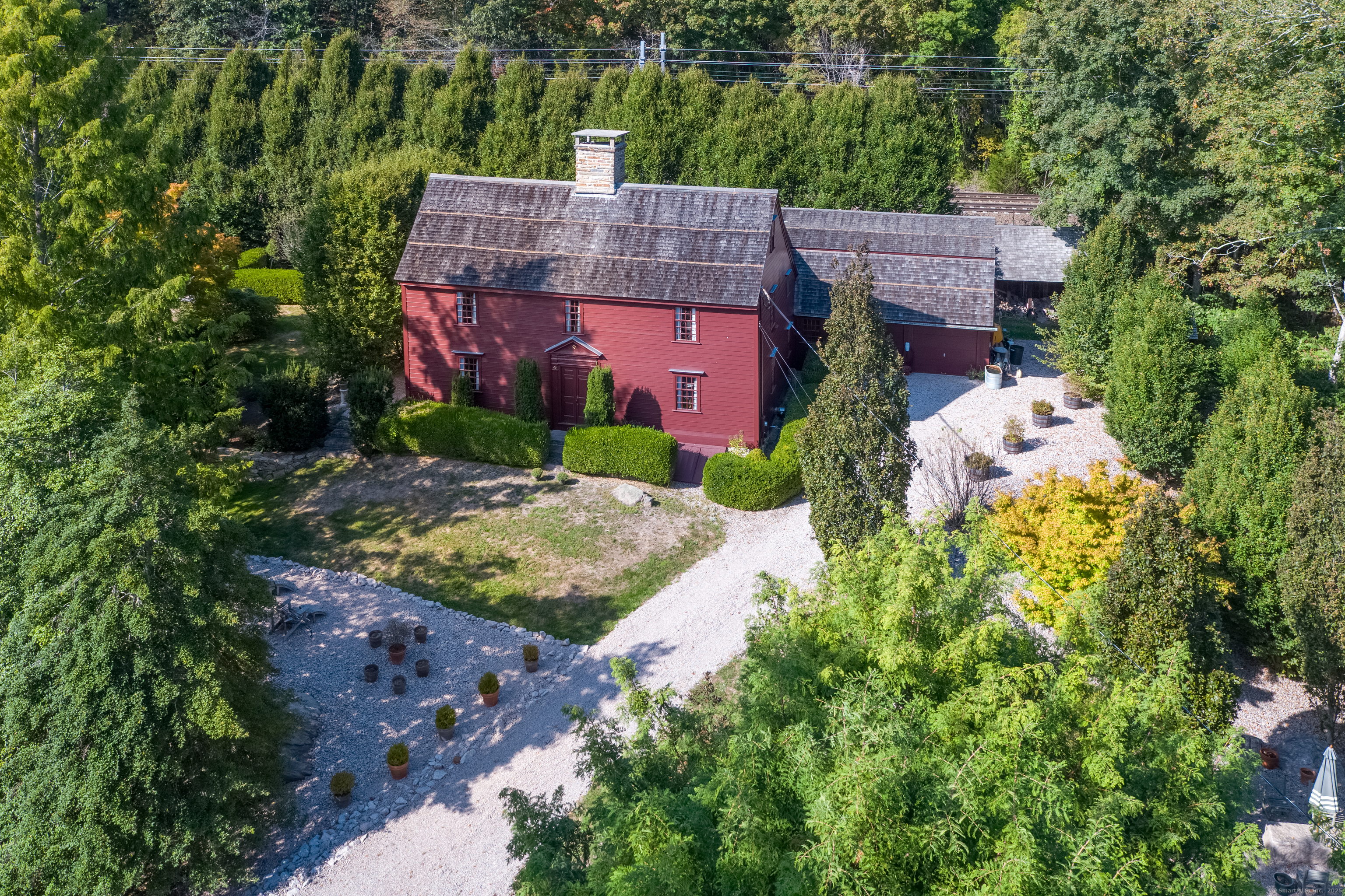 575 Leetes Island Road Guilford, CT 06437 - Photo 2 of 39 an aerial view of house with yard and mountain view in back