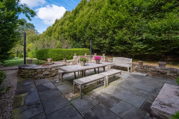 a view of a backyard with sitting area