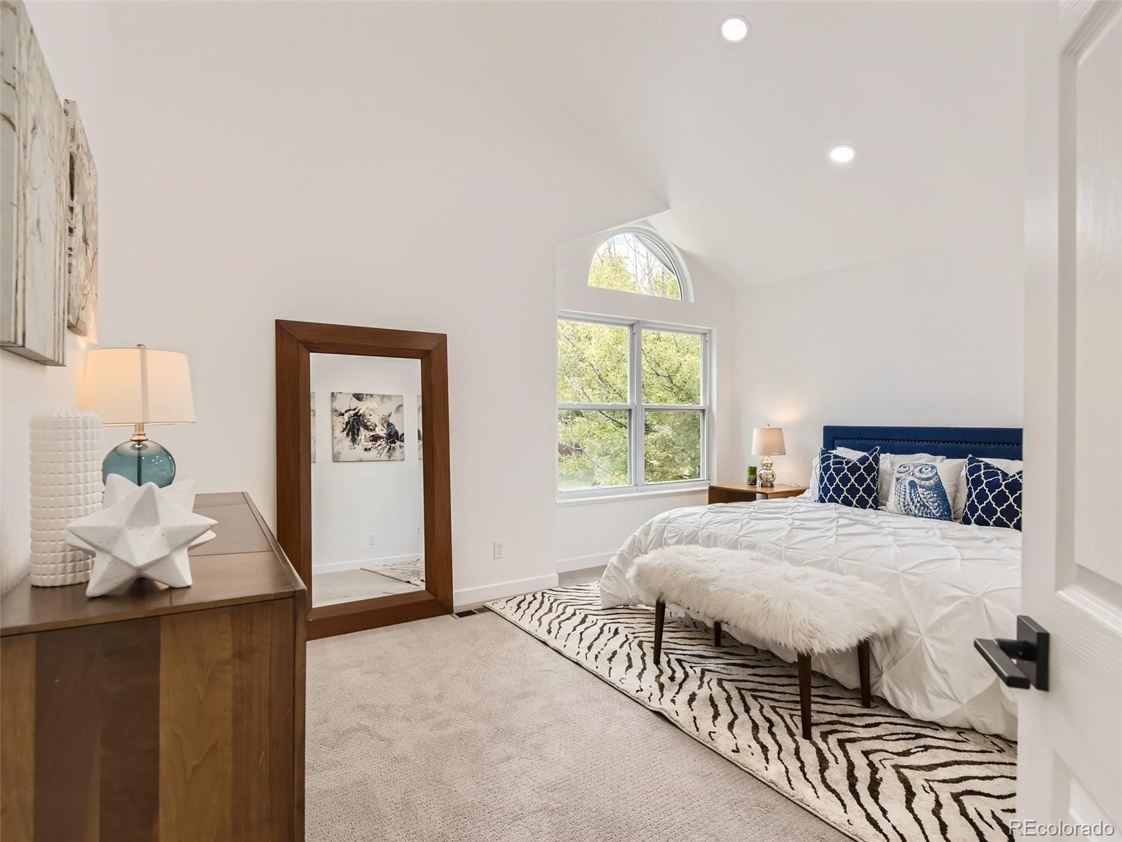 6222 Yale Drive Highlands Ranch, CO 80130 - Photo 13 of 32 a bedroom with a bed and a window
