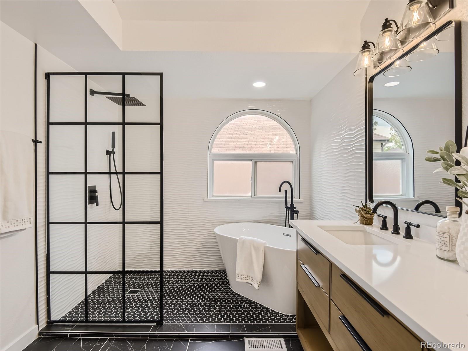 6222 Yale Drive Highlands Ranch, CO 80130 - Photo 16 of 32 a bathroom with a sink and a mirror