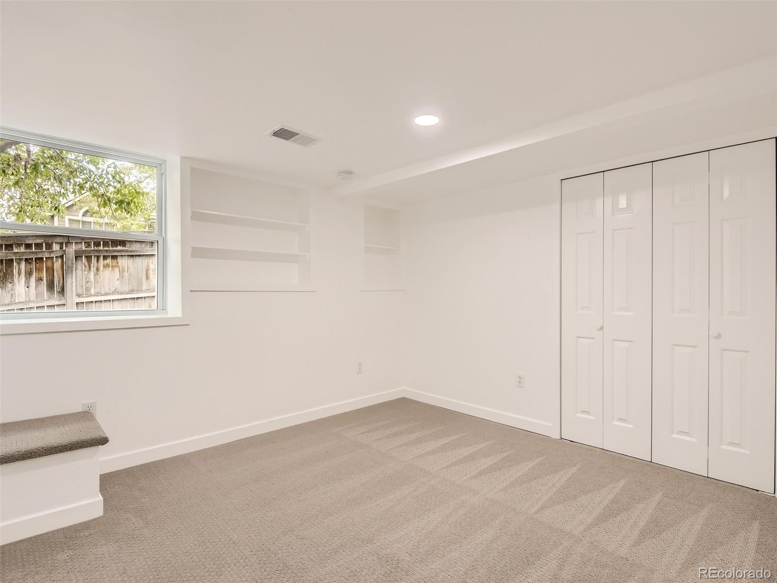 6222 Yale Drive Highlands Ranch, CO 80130 - Photo 22 of 32 a view of an empty room with a window