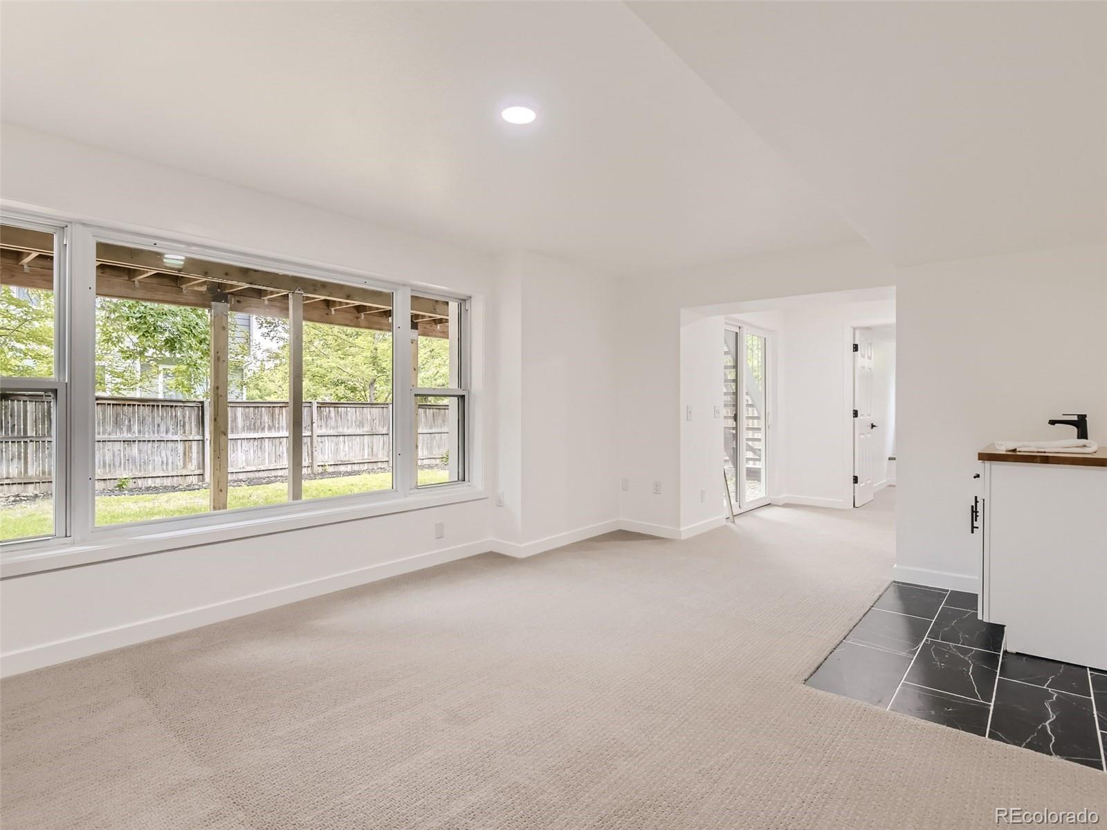6222 Yale Drive Highlands Ranch, CO 80130 - Photo 23 of 32 a big room with windows and closet