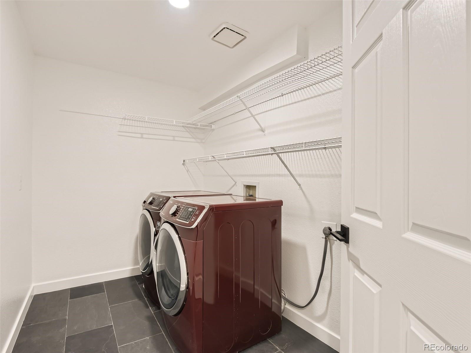 6222 Yale Drive Highlands Ranch, CO 80130 - Photo 24 of 32 a utility room with dryer and washer