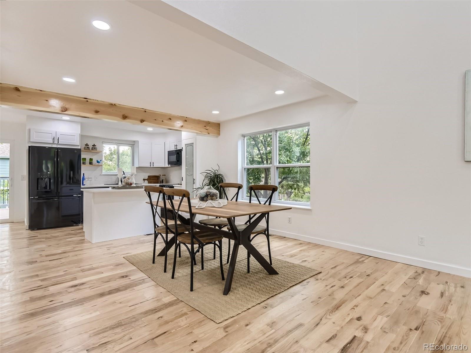 6222 Yale Drive Highlands Ranch, CO 80130 - Photo 6 of 32 a dining room with furniture and wooden floor