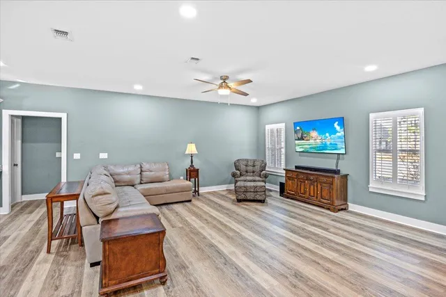 a kitchen with stainless steel appliances kitchen island granite countertop a stove a sink and a refrigerator