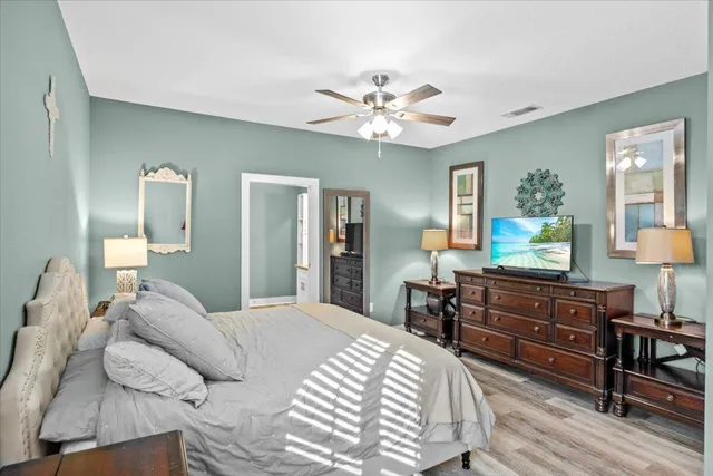 a bathroom with a tub shower and vanity