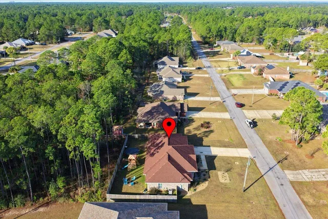 a sign that is sitting in front of flowers
