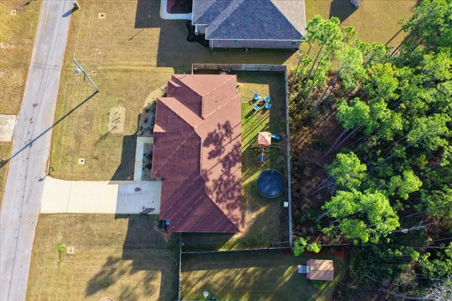 a living room with furniture and view of kitchen