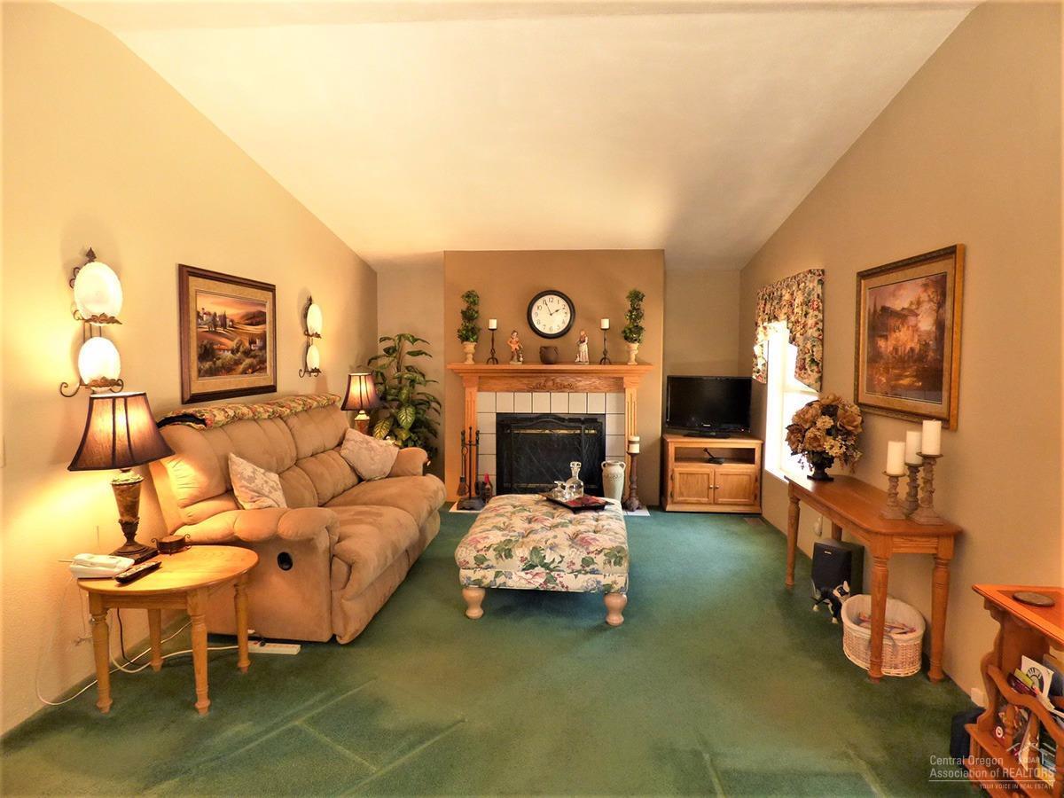 19176 Baker Road Bend, OR 97702 - Photo 11 of 25 a living room with furniture and a fireplace