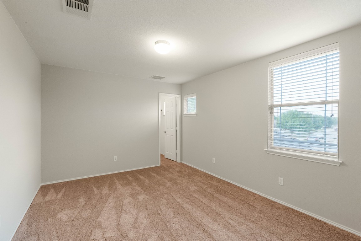 11532 Ashbrook Drive Manchaca, TX 78652 - Photo 18 of 30 an empty room with windows