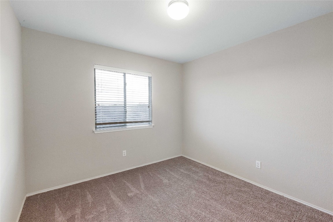 11532 Ashbrook Drive Manchaca, TX 78652 - Photo 20 of 30 an empty room with a window