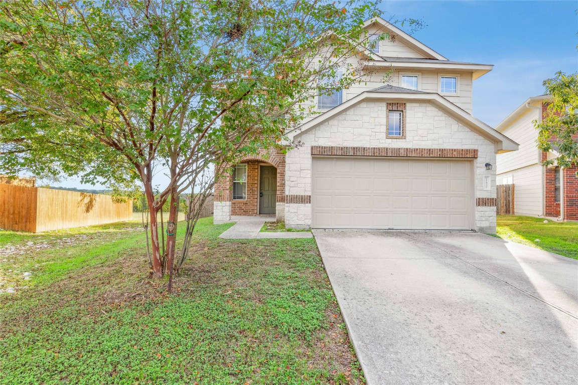 11532 Ashbrook Drive Manchaca, TX 78652 - Photo 27 of 30 a front view of a house with a yard