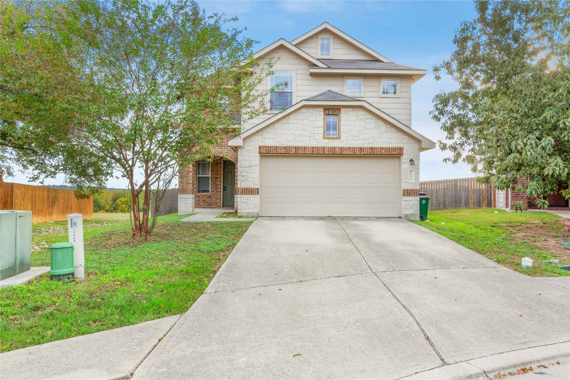 11532 Ashbrook Drive Manchaca, TX 78652 - Photo 29 of 30 a front view of a house with a yard