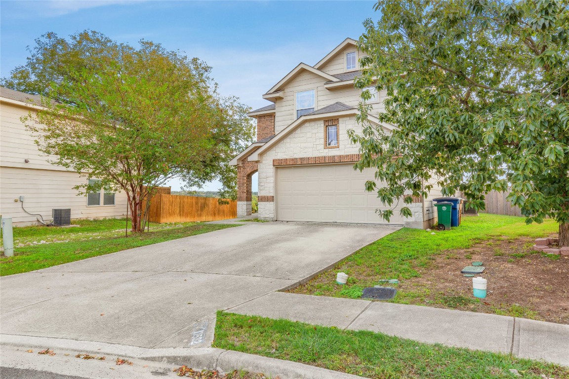 11532 Ashbrook Drive Manchaca, TX 78652 - Photo 30 of 30 a view of a yard with plants and a large tree