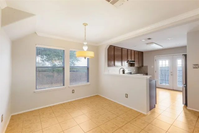 a view of a kitchen with furniture and windows