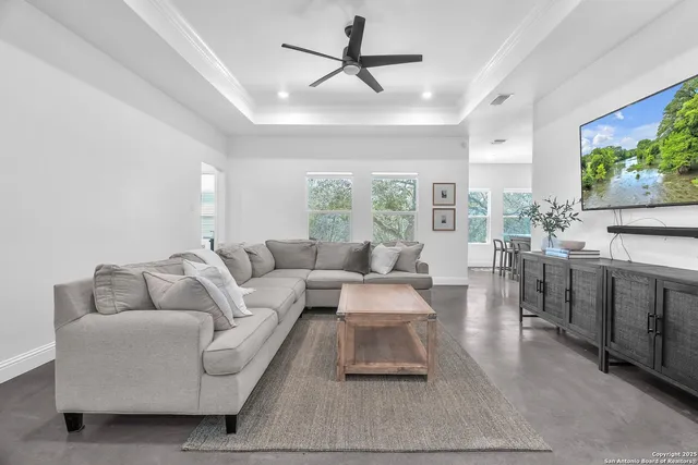 a living room with furniture and a large window