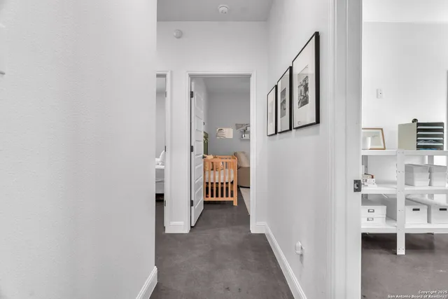 a view of a hallway with seating area