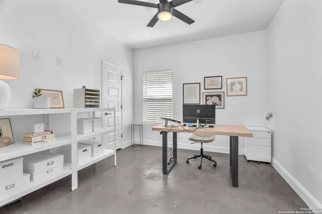 a view of a workspace with furniture