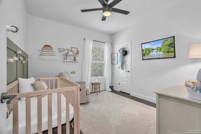 a bedroom with furniture and a window