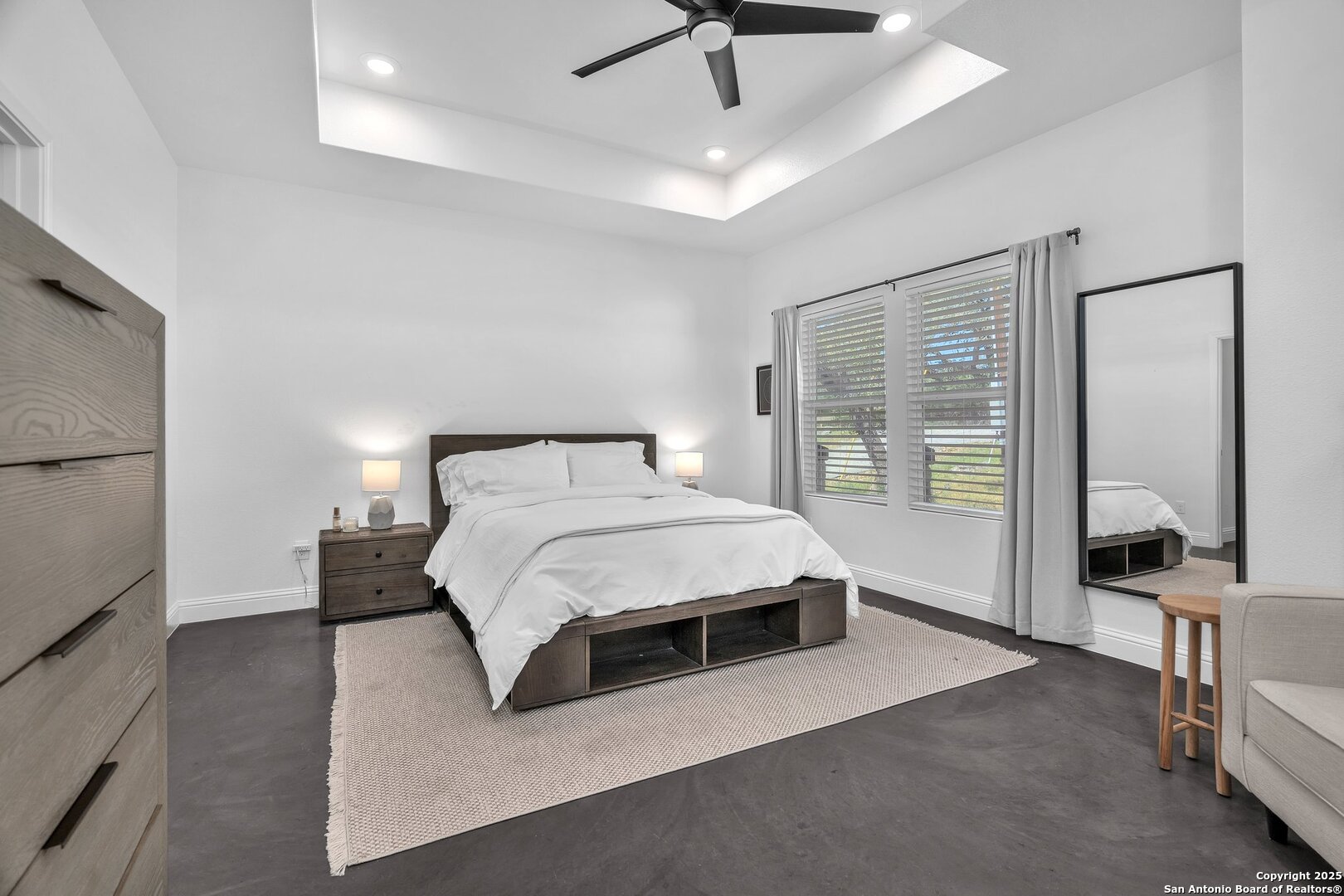 348 Fawn Drive Spring Branch, TX 78070 - Photo 22 of 50 a bedroom with a large bed and a chandelier