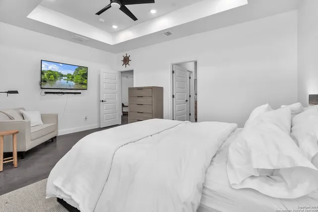 a bedroom with a bed and a couch