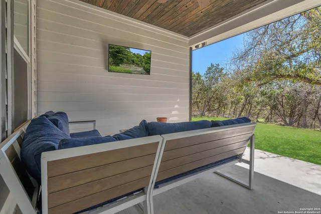 a view of sitting area in front of house with yard