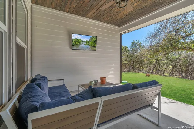 a view of outdoor sitting area with furniture