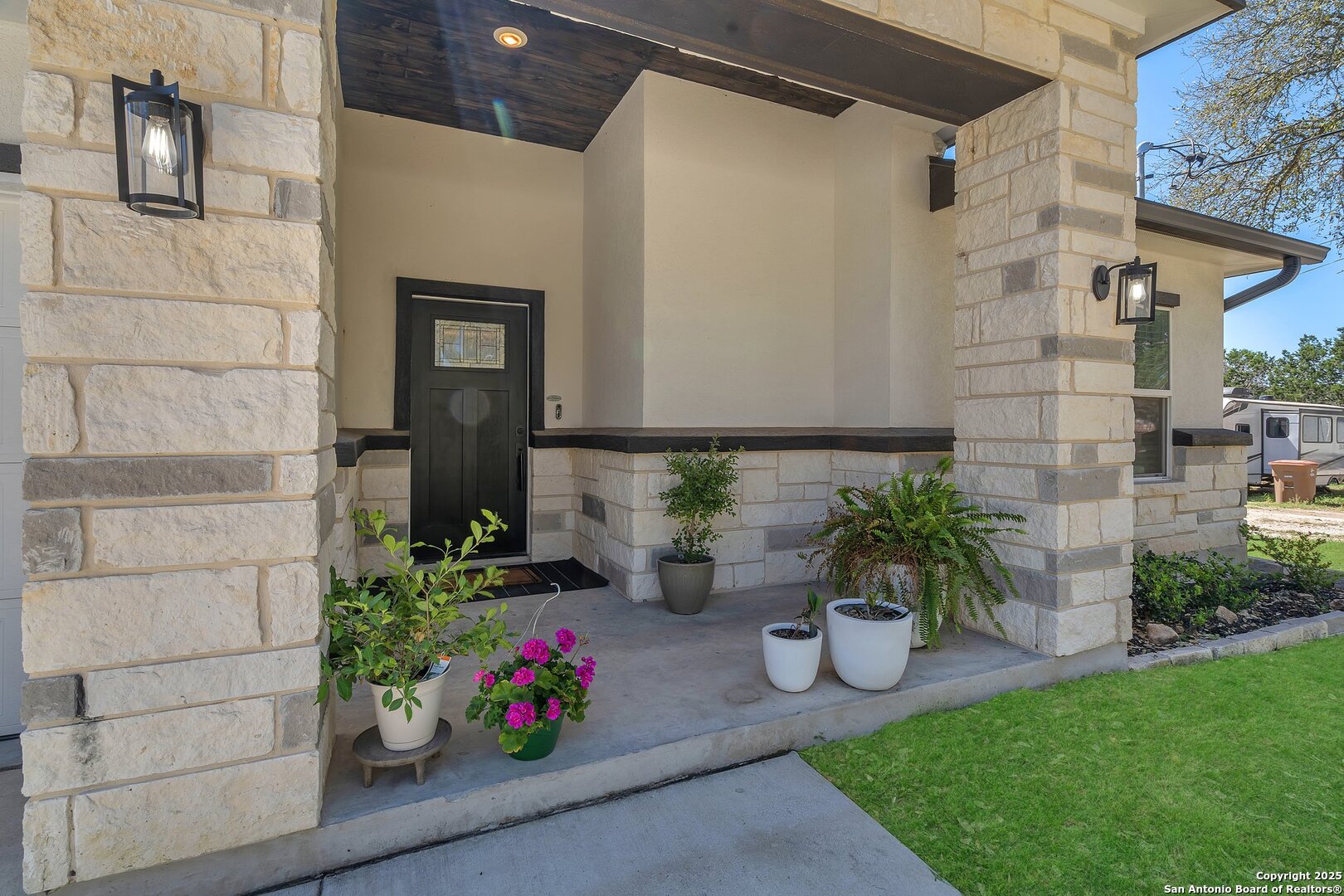 348 Fawn Drive Spring Branch, TX 78070 - Photo 8 of 50 a view of a porch with potted plants