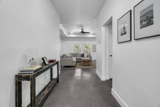 a view of a livingroom with furniture and windows