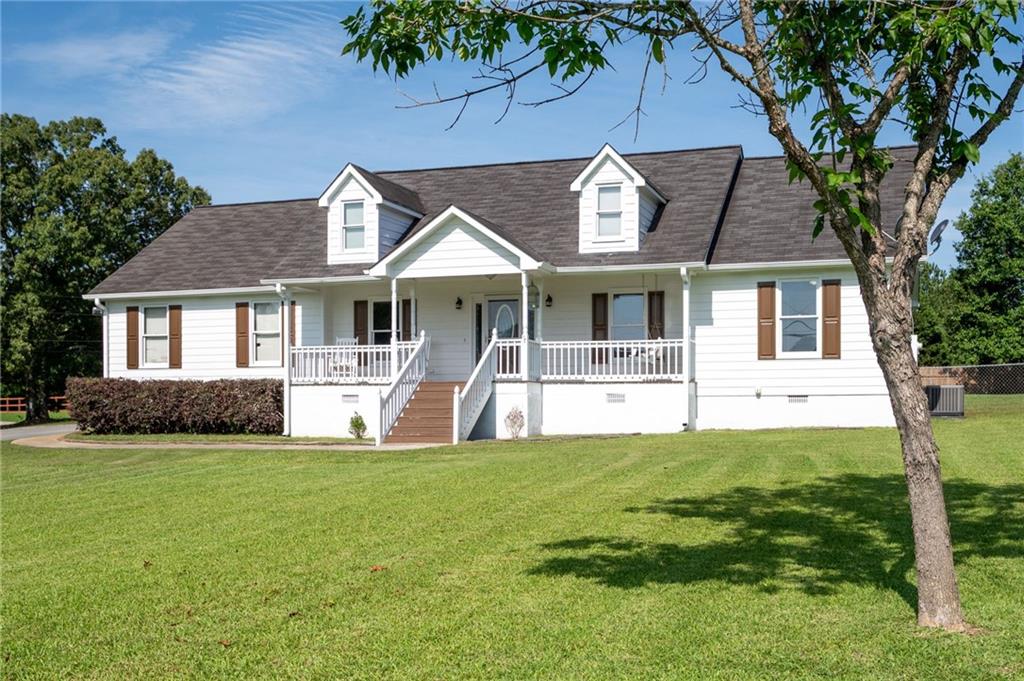 824 Baldwin Road Rockmart, GA 30153 - Photo 1 of 1 a front view of a house with a yard porch and mountain