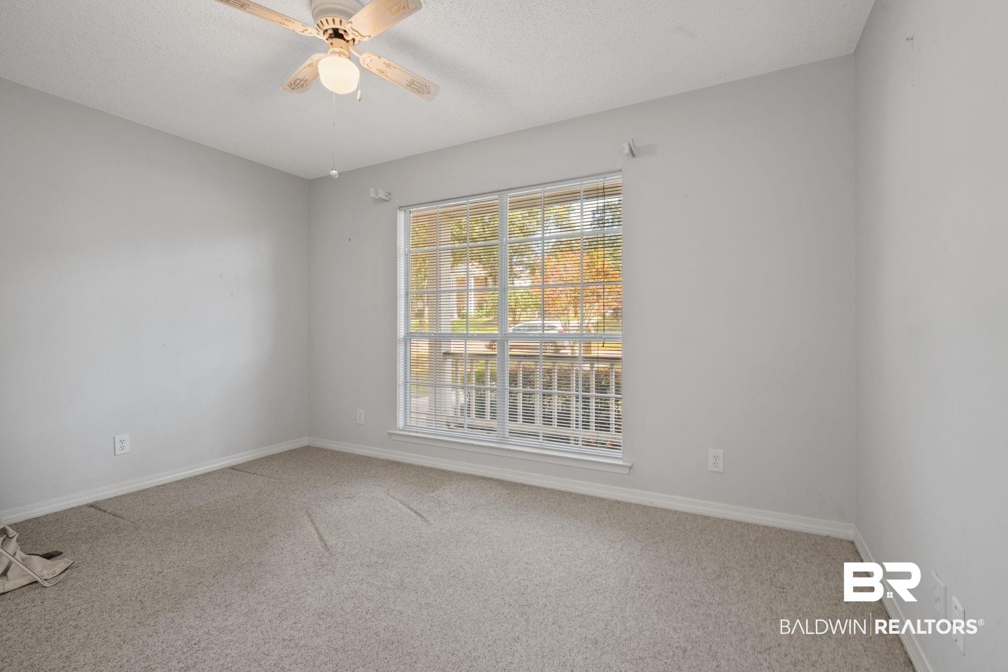 1340 Wellsley Court Mobile, AL 36695 - Photo 22 of 37 Empty room featuring light colored carpet, ceiling fan, and a textured ceiling