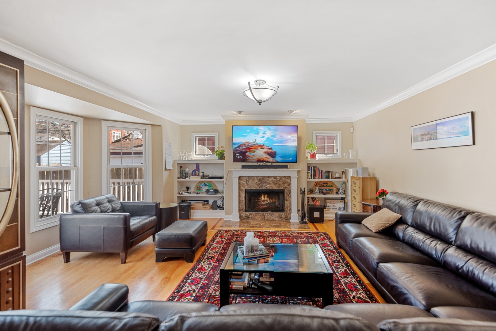 463 Green Bay Road Highland Park, IL 60035 - Photo 2 of 27 a living room with furniture a flat screen tv and a fireplace
