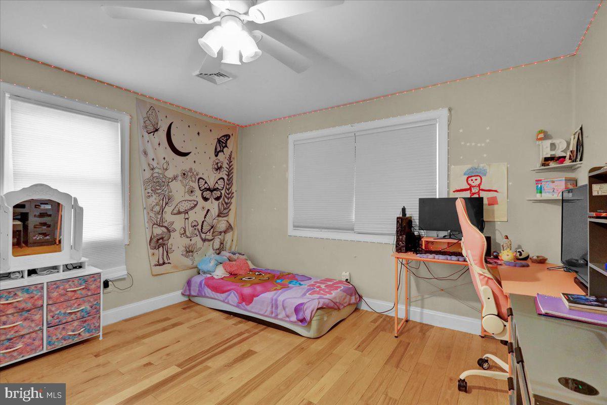 12 Trimble Boulevard Brookhaven, PA 19015 - Photo 11 of 34 a bedroom with a bed and a chandelier