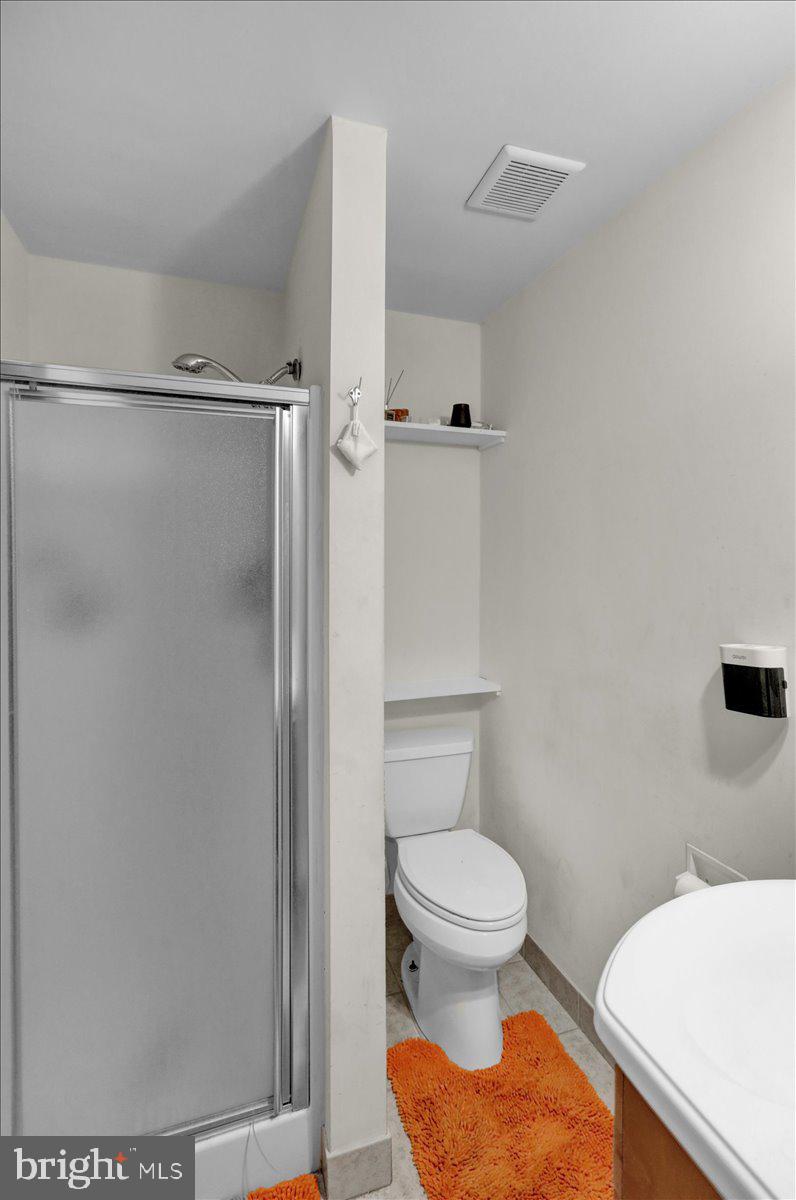 12 Trimble Boulevard Brookhaven, PA 19015 - Photo 15 of 34 a bathroom with a toilet and a shower