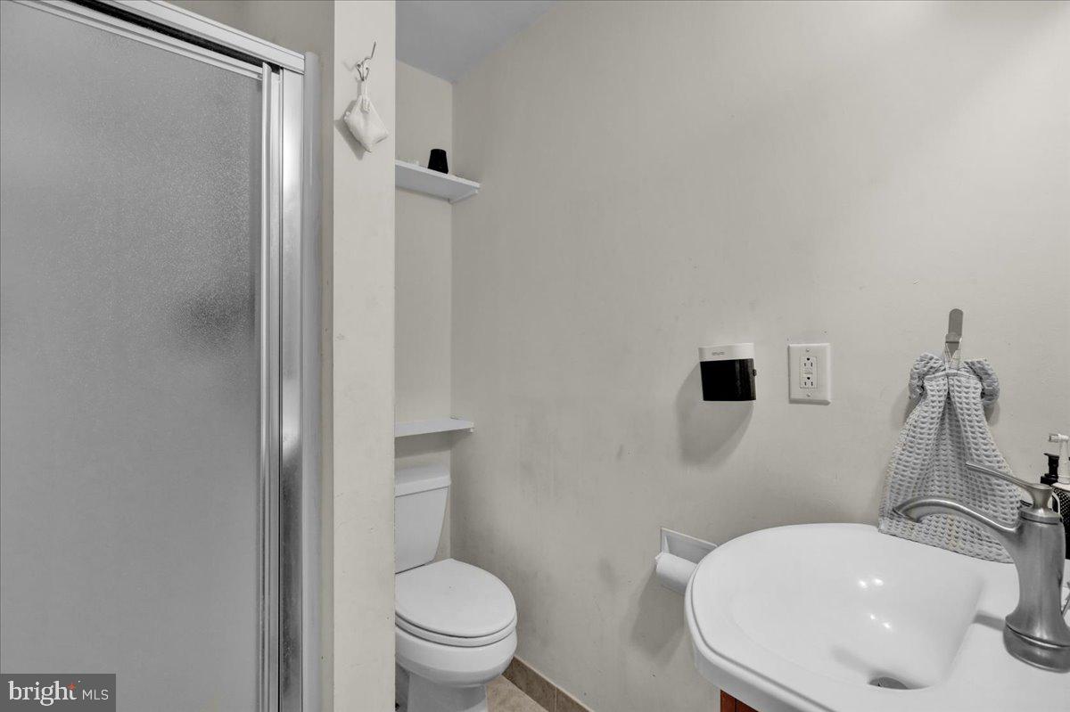 12 Trimble Boulevard Brookhaven, PA 19015 - Photo 16 of 34 a bathroom with a sink a toilet and shower