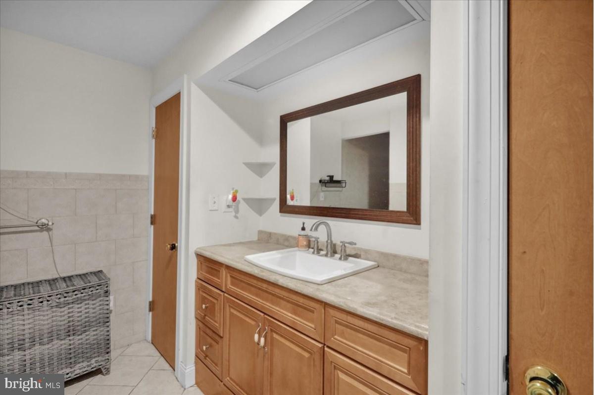 12 Trimble Boulevard Brookhaven, PA 19015 - Photo 19 of 34 a bathroom with a sink and a mirror