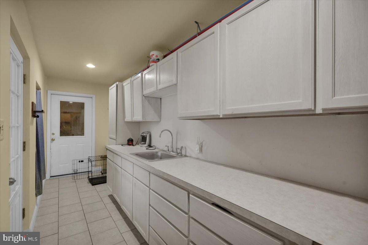 12 Trimble Boulevard Brookhaven, PA 19015 - Photo 22 of 34 a kitchen with a sink dishwasher and cabinets