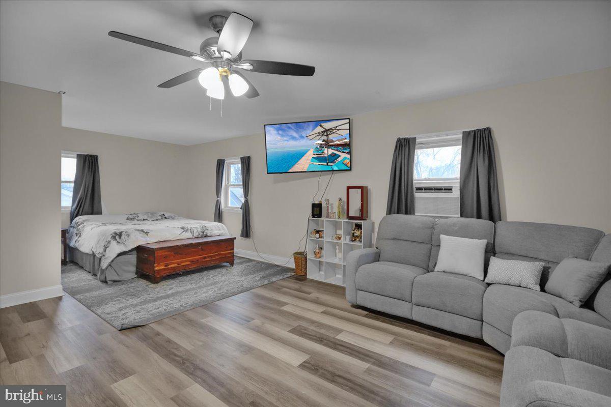 12 Trimble Boulevard Brookhaven, PA 19015 - Photo 25 of 34 a bedroom with furniture and a chandelier